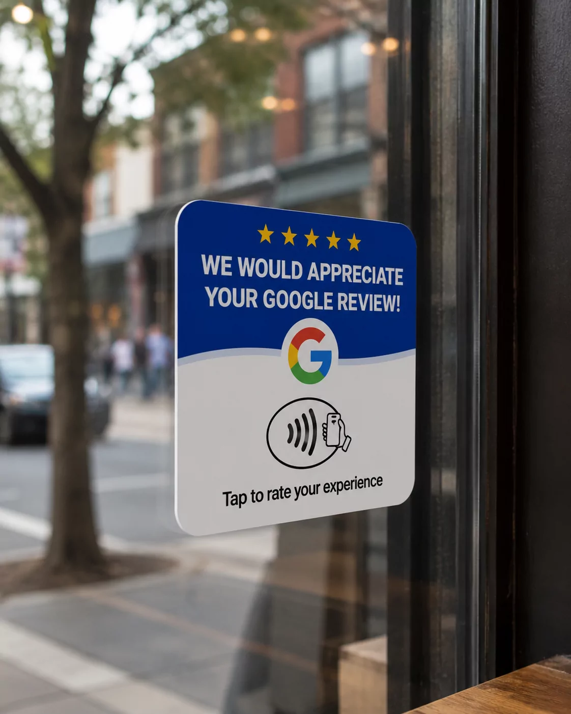 The blue and white review plate stuck to the inside of a shopfront window, with the street and passers-by out of focus beyond the glass